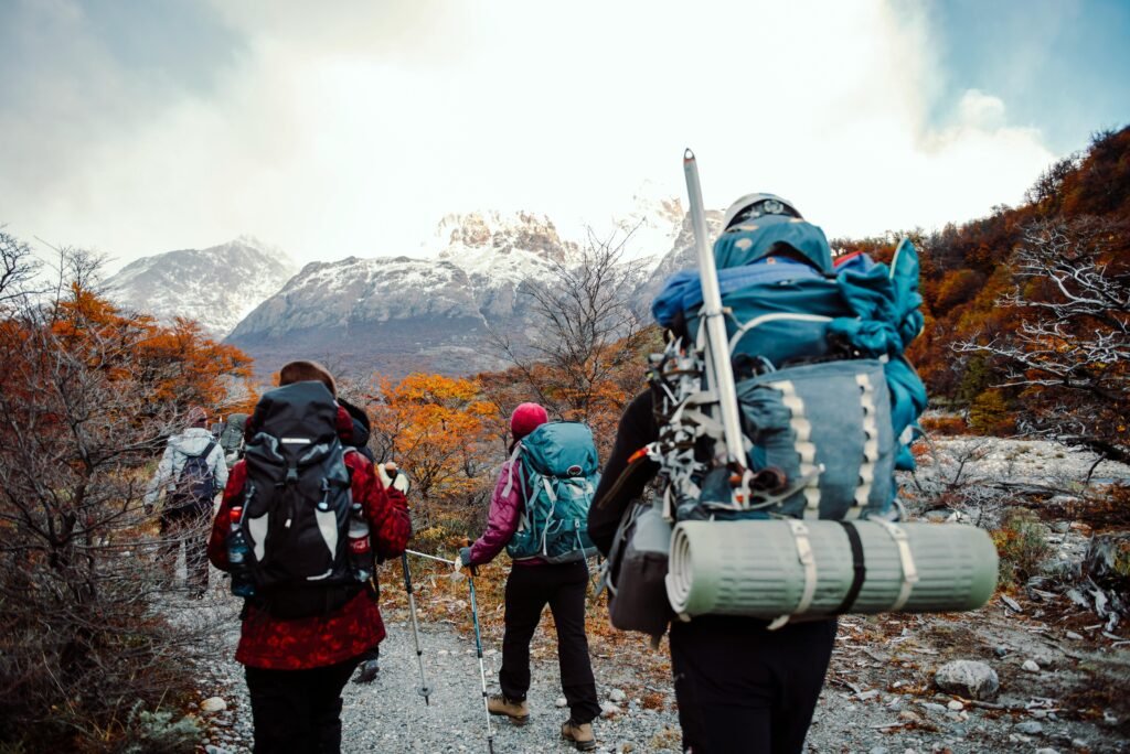 Group of backpackers trekking through the autumn colors in El Chalten, Argentina.